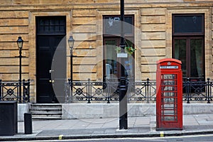 Red phone booths in central London. UK.