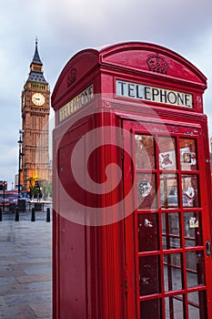 Red phone box in front of the Big Ben in London