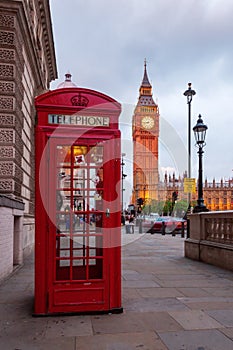 Red phone box in front of the Big Ben in London