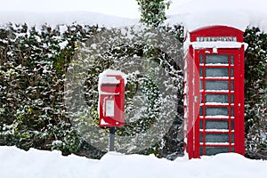 Red phonebox in the snow