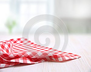 Red picnic checkered cloth on white wooden background empty copy space,food advertisement frame design