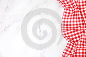 Red picnic cloth on table top view,checkered gingham towel on whote background empty space