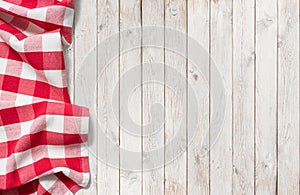 Red picnic cloth on white wood table