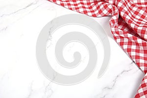 Red picnic towel on white table top view empty space