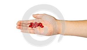 Red Pill Capsules Medicine in Hand Isolated