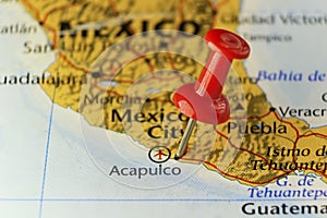 Red pin on Acapulco city in Mexico