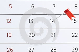 Red pin flag on a calendar. Important date. Place for text.