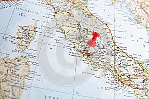 Red pin in a map of the Italy pointing out Vatican city as a concept for a desitnation one wishes to go to or has visted already photo