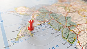 A red pin stuck in Abersoch on a map of west Wales photo