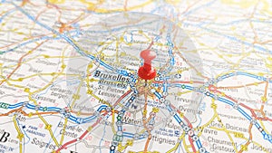 A red pin stuck in Brussels on a map of Belgium