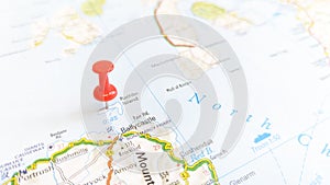 A red pin stuck in Rathlin Island on a map of Northern Ireland