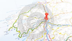 A red pin stuck in Santiago de Compostela on a map of Spain photo