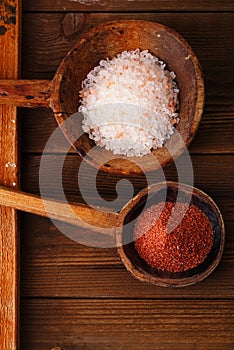 Red and Pink Crystal Rock salt in rustic wooden spoons