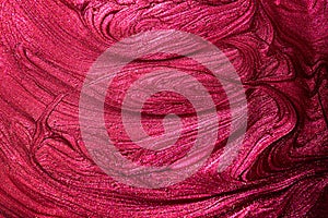 Red pink enamel nail polish texture background. Makeup varnish sample abstraction