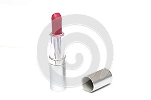 A red pink lipstick and its cover cap