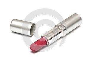 A red pink lipstick and its cover cap