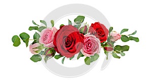 Red and pink rose flowers with eucalyptus leaves in a line arrangement