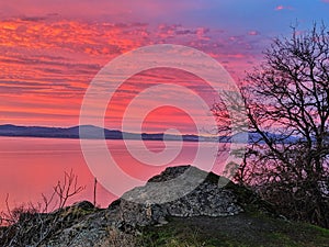 Red and pink sunset over the lake.