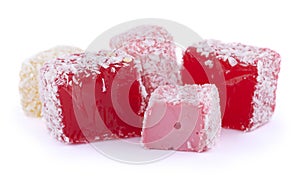 Red and pink Turkish Delight in coconut chips isolated on white background