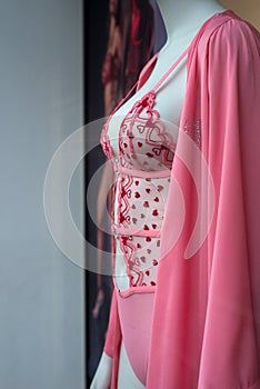 red and pink underwear with little hearts on mannequin in a fashion store showroom