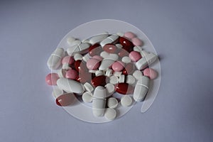 Red, pink and white pills
