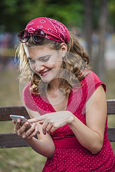 Red pinup woman amused by internet content