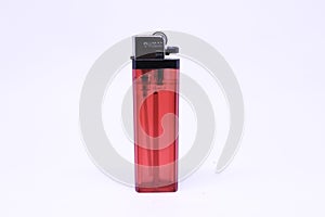 Red plastic cigarette lighter on white background