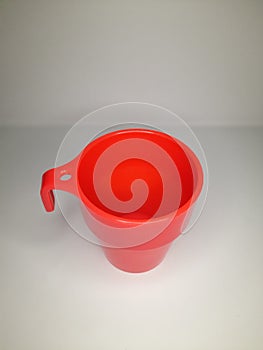 red plastic cup on a white base
