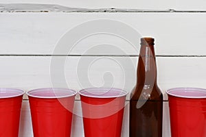 Red Plastic Drinking Cups and One Beer Bottles