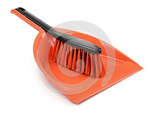 Red plastic dustpan and brush
