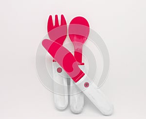 Red plastic knife, spoon and fork