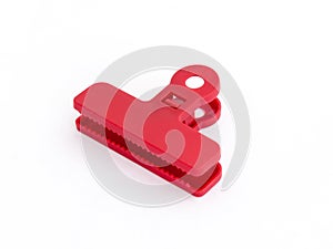 Red plastic medium size clothespin for plastic bags isolated on a white background