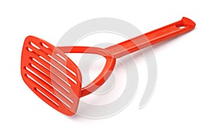 Red plastic potato and vegetables masher
