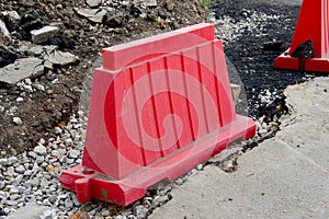 A red plastic road block on the roadside