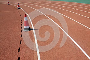 red plastic runway and conical barrel