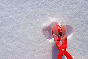red plastic snowball maker on the white snow. The concept of winter holidays