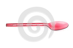 Red plastic spoon isolated on white