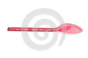 Red plastic spoon isolated on white