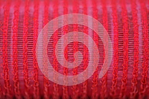 Red plastic texture of striped bristles