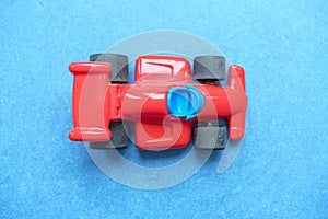 Red plastic toy racing car