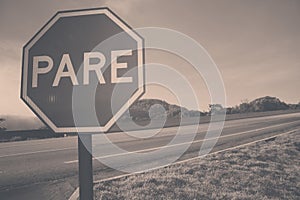 Red plate stop PARE transit sign