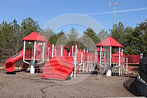 Red playgroud outdoors and blue sky photo