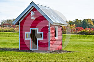 Red Playhouse with Cross and School Bell