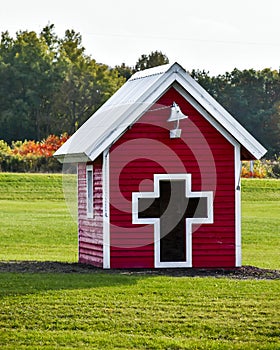 Red Playhouse with Cross and School Bell