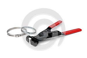 Red pliers for steel belt clamps isolated on white background.
