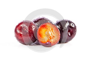 Red plum fruit isolated on white