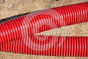 Red plumbing pipe close-up. Drainage, tubing, pipes. Red pipes of the water supply and heating system.