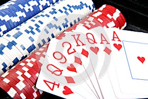 Red poker cards and different chips