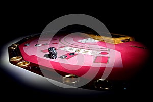 Red poker table with cards and tokens.