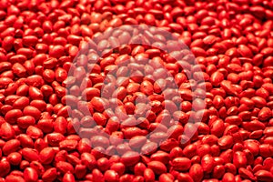 Red polymer dye in granules, background texture